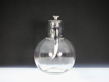 Load image into Gallery viewer, A Stylish Hukin & Heath silver plated claret jug after a design attributed to Dr Christopher Dresser .