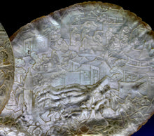 Load image into Gallery viewer, A pair of late Qing dynasty finely carved mother-of-pearl shells depicting a village scenes, circa 1880