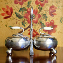 Load image into Gallery viewer, A Fenton Brothers Ltd silver plated double "curling stone" cruet stand. Sheffield circa 1875-1896