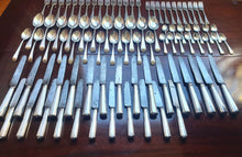 Load image into Gallery viewer, A Georgian sterling silver bright-cut engraved feather edge cutlery setting. English late 18th (1775-1785)