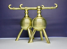 Load image into Gallery viewer, A pair of Brass Aesthetic Movement Fire Dogs. Designed by Dr Christopher Dresser made by Benham & Froud. English Circa 1880