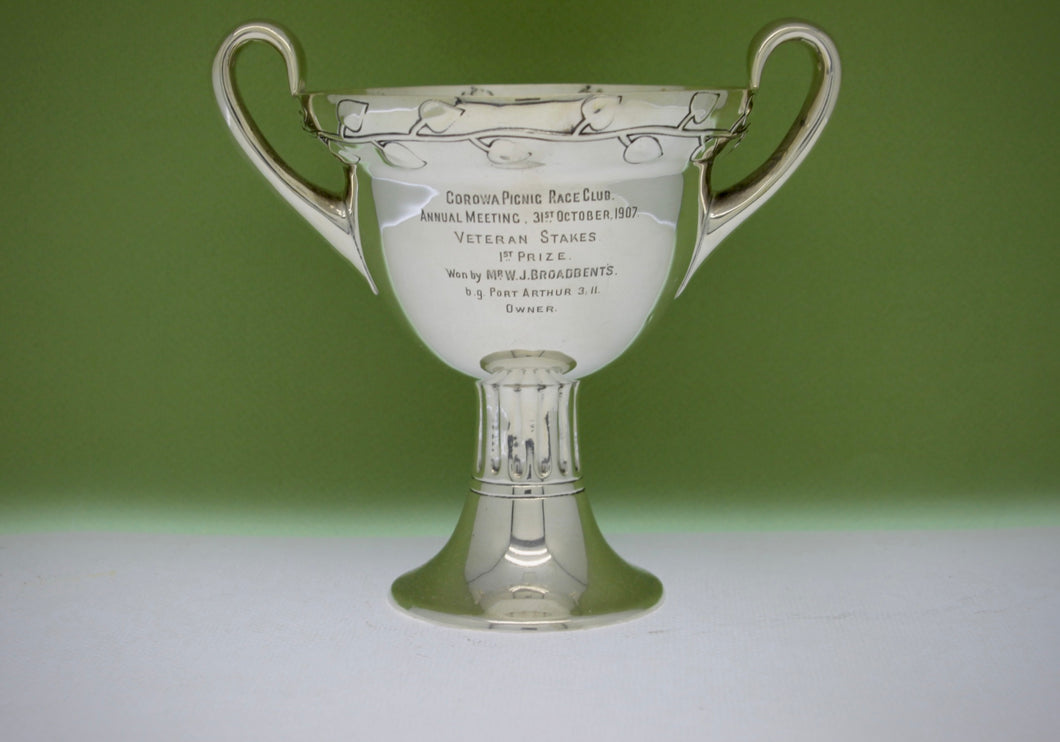 An Edwardian Arts and Crafts sterling silver two handled cup.Chester 1906
