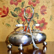 Load image into Gallery viewer, A Fenton Brothers Ltd silver plated double "curling stone" cruet stand. Sheffield circa 1875-1896
