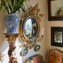 Load image into Gallery viewer, A Regency gilt wood and gesso convex mirror. English circa 1815
