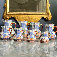 Load image into Gallery viewer, A rare graduated set of eight Mason's Ironstone Hydra jugs. English circa 1820-30
