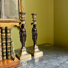 Load image into Gallery viewer, A pair of Grand Tour bronze and gilt metal classical figural candlesticks
