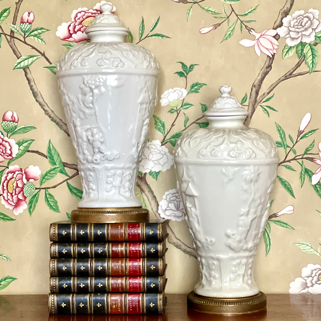 A pair of ormolu mounted chinoiserie blanc de chine porcelain vases  and covers Retailed by, Gallery Au Vase Étrusque. Paris
