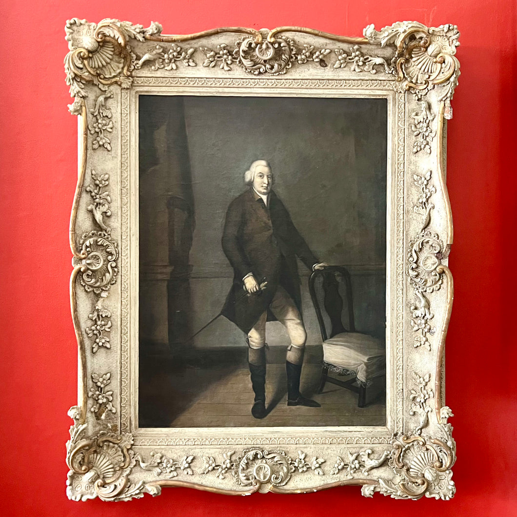 In the style of Arthur Devis (1712-1787) A framed full-length portrait of a gentleman in a brown coat.