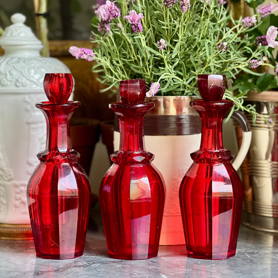 A rare set of three early 19th century Ruby Red Glass Decanters  circa 1840