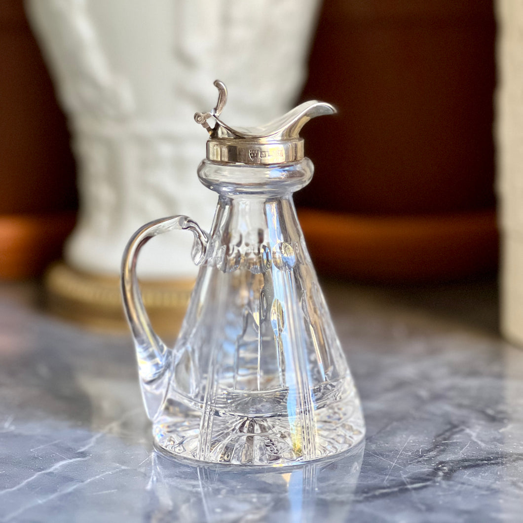 A sterling silver mounted cut crystal whisky noggin. Birmingham 1972