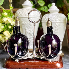 Load image into Gallery viewer, A 19th century silver plated twin bottle decanter stand on a carved cedar base. Circa 1880
