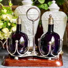 Load image into Gallery viewer, A 19th century silver plated twin bottle decanter stand on a carved cedar base. Circa 1880
