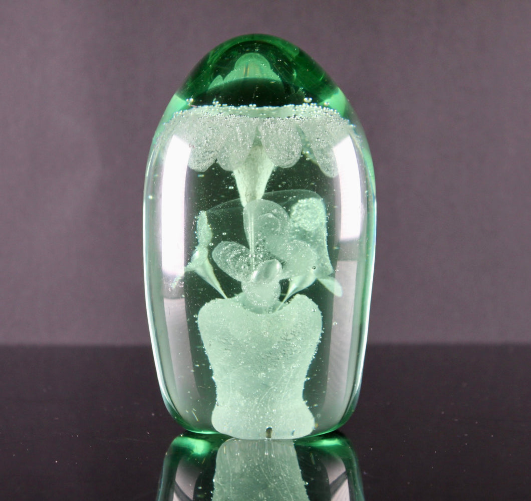 A large 19th century green glass 'Dump' paperweight circa 1850