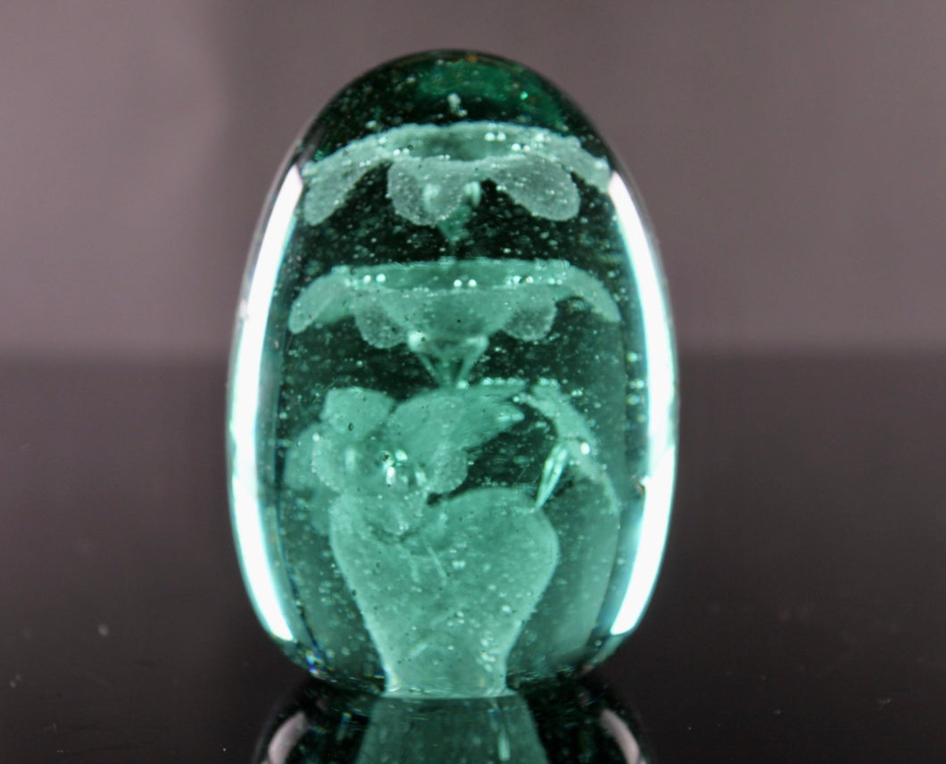 A 19th century green glass 'Dump' paperweight. circa 1850