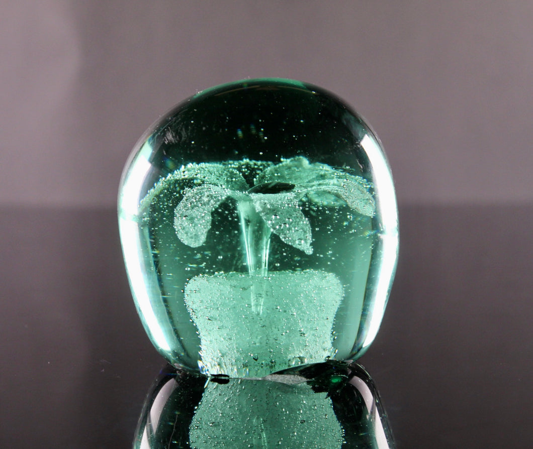 A 19th century green glass 'Dump' paperweight. circa 1850