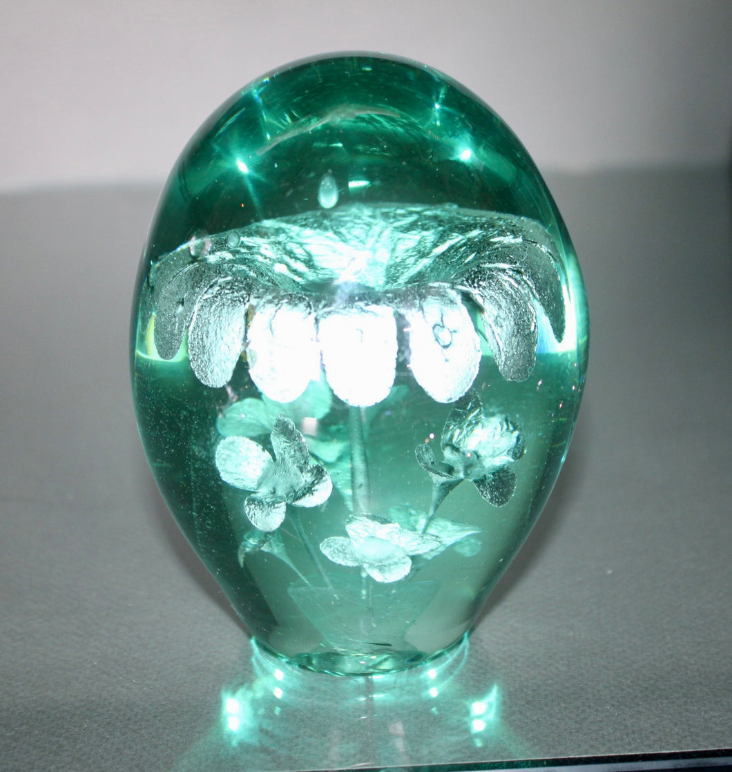 A 19th century green glass 'Dump' doorstoop/paperweight. Circa 1850